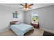 Bright bedroom with window, ceiling fan, and minimalist decor at 4809 Walnut Ridge Rd, Land O Lakes, FL 34638