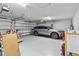 Spacious garage with ample storage space and a modern SUV at 4809 Walnut Ridge Rd, Land O Lakes, FL 34638