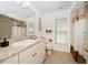 Bright bathroom with neutral colors, granite countertops, and tiled shower and flooring at 4868 Lake Valencia E Blvd, Palm Harbor, FL 34684