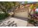 Attached two-car garage with a long driveway at 4868 Lake Valencia E Blvd, Palm Harbor, FL 34684