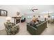 Spacious living room with fireplace, tile flooring, ceiling fan and plenty of natural light at 4868 Lake Valencia E Blvd, Palm Harbor, FL 34684