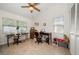 Well-lit office space with two desks, ceiling fan, and tile flooring at 4868 Lake Valencia E Blvd, Palm Harbor, FL 34684