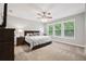 Bedroom featuring neutral walls, carpet, ceiling fan, and a window allowing natural light to illuminate the space at 5949 Parkset Dr, Lithia, FL 33547