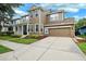 Charming two-story home with a wide driveway, attached garage and landscaped front yard at 5949 Parkset Dr, Lithia, FL 33547