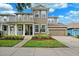 Two-story home with a welcoming porch and well-kept lawn, complemented by an attached two-car garage at 5949 Parkset Dr, Lithia, FL 33547
