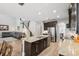 Open concept kitchen with an island, granite countertops, stainless appliances and staircase to 2nd floor at 5949 Parkset Dr, Lithia, FL 33547