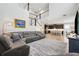 Open-concept home with staircase leading upstairs and view into the kitchen at 5949 Parkset Dr, Lithia, FL 33547