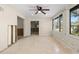 Living room featuring tile floors and exterior views at 624 Orange St, Palm Harbor, FL 34683