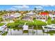 Aerial view of luxury homes with private docks and pools along waterfront canal at 6301 Marbella Blvd, Apollo Beach, FL 33572