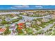 Stunning aerial view of waterfront home showcasing its prime location and gorgeous surrounding community at 6301 Marbella Blvd, Apollo Beach, FL 33572