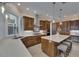 Modern kitchen boasts stainless steel appliances, granite countertops, and custom cabinetry and a large island at 6301 Marbella Blvd, Apollo Beach, FL 33572
