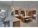 Gourmet kitchen with a large island, custom cabinets, stainless steel appliances and tiled backsplash at 6301 Marbella Blvd, Apollo Beach, FL 33572