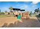 Playground with climbing structures and slides, next to community pool and clubhouse at 6301 Marbella Blvd, Apollo Beach, FL 33572
