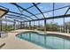 Beautiful screened-in pool and spa overlooking the water, offering a tranquil and luxurious experience at 6301 Marbella Blvd, Apollo Beach, FL 33572