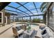 Relaxing screened-in pool area with comfortable seating, perfect for enjoying sunny days and outdoor living at 6301 Marbella Blvd, Apollo Beach, FL 33572
