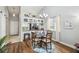 Cozy dining area with modern chandelier, and view to kitchen with breakfast bar at 6529 Thicket Trl, New Port Richey, FL 34653