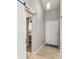 Bright entryway with neutral tones, tile flooring, and stylish sliding door at 6529 Thicket Trl, New Port Richey, FL 34653