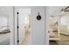 Hallway view showing doorways to the bathroom and bedroom areas, demonstrating the home's functional design at 772 Live Oak Ne Ter, St Petersburg, FL 33703