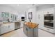Modern kitchen featuring stainless steel appliances, granite counters, island and eat-in dining area at 772 Live Oak Ne Ter, St Petersburg, FL 33703