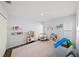 Spacious playroom with ample space for play equipment and a cozy seating area, perfect for activities at 772 Live Oak Ne Ter, St Petersburg, FL 33703