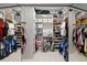 Organized walk-in closet with mirrored doors, shelving and hanging storage for optimal storage solutions at 772 Live Oak Ne Ter, St Petersburg, FL 33703