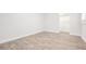 Bright bedroom with wood-look tile flooring and a closet at 805 E Elm St, Tampa, FL 33604