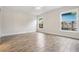 Bright, empty bedroom with wood-look floors and dual windows, offering a blank canvas at 805 E Elm St, Tampa, FL 33604