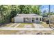 Cozy single-story house with a covered front porch and side driveway at 805 E Elm St, Tampa, FL 33604