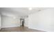 Bright and spacious living room with wood-look tile flooring and ceiling fan at 805 E Elm St, Tampa, FL 33604