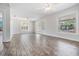 Bright and airy living room featuring wood-look floors and multiple windows at 805 E Elm St, Tampa, FL 33604