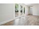 Room with wood-look tile flooring and glass doors that offer backyard views at 805 E Elm St, Tampa, FL 33604