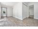 Bright room featuring wood-look tile flooring, a closet, and connections to other rooms at 805 E Elm St, Tampa, FL 33604