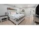 Cozy bedroom with neutral decor, tile flooring, and ample natural light at 831 72Nd N Ave, St Petersburg, FL 33702