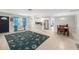 Open living room with tile floors, a ceiling fan and view of the kitchen and dining area at 831 72Nd N Ave, St Petersburg, FL 33702