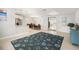 Bright and airy living room with tile floors and a decorative rug that complements the open layout at 831 72Nd N Ave, St Petersburg, FL 33702