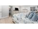 Inviting main bedroom features tile flooring, neutral walls and a view of the ensuite bathroom at 831 72Nd N Ave, St Petersburg, FL 33702