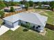 Aerial view of a well-maintained home with a large, fenced backyard at 8442 Pinewood Ave, Brooksville, FL 34613