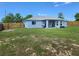 Home's backyard showing fence and the house at 8442 Pinewood Ave, Brooksville, FL 34613