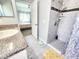 Bathroom featuring a glass-enclosed shower with updated shower fixtures at 8442 Pinewood Ave, Brooksville, FL 34613