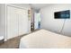 View of bedroom including closet, decor, and wall-mounted television at 8442 Pinewood Ave, Brooksville, FL 34613