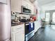 Bright kitchen with stainless steel appliances and granite counters at 8442 Pinewood Ave, Brooksville, FL 34613