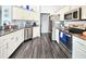 Kitchen features stainless appliances, granite counters, and ample cabinet space at 8442 Pinewood Ave, Brooksville, FL 34613