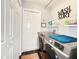 Laundry room with modern washer and dryer and extra storage space at 8442 Pinewood Ave, Brooksville, FL 34613