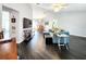 Open-concept living room with hardwood floors and abundant natural light at 8442 Pinewood Ave, Brooksville, FL 34613