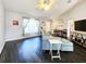 Bright and airy living room featuring laminate flooring and modern decor at 8442 Pinewood Ave, Brooksville, FL 34613