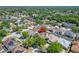 Overhead view showcases a home in a lush, green neighborhood with mature trees at 9504 Laurel Ledge Dr, Riverview, FL 33569