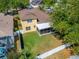 Aerial view showcasing the property's spacious backyard and screened patio at 9504 Laurel Ledge Dr, Riverview, FL 33569