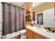 A bathroom with a shower/tub combo and a wood vanity at 9504 Laurel Ledge Dr, Riverview, FL 33569