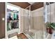 A bathroom featuring a glass shower and adjacent walk-in closet at 9504 Laurel Ledge Dr, Riverview, FL 33569