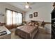 A decorated bedroom features an accent wall and a large window at 9504 Laurel Ledge Dr, Riverview, FL 33569